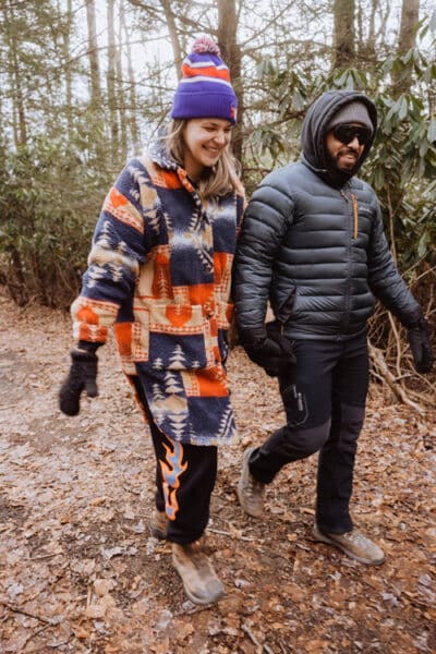 A happy couple enjoy the stroll and the brisk fall weather along the turkey wilderness trail